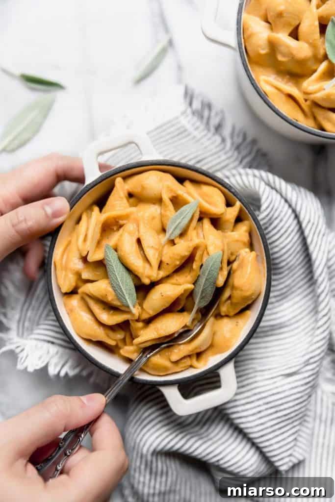 Pumpkin Vegan Mac and cheese with sage leaves on top