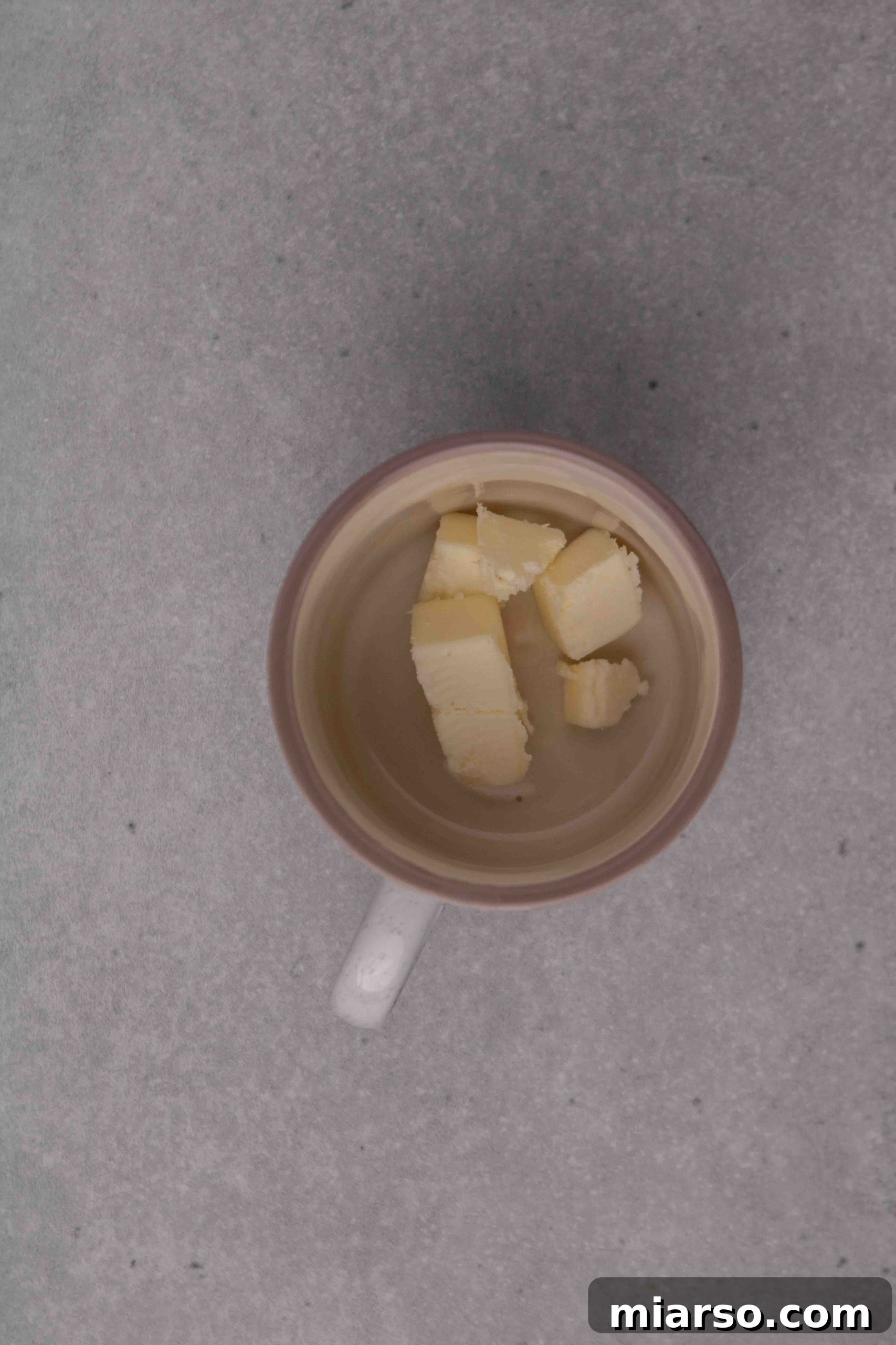 Pillowy Soft Mug Sugar Cookie Perfection 5 Initial steps of making a sugar cookie in a mug: melting butter.