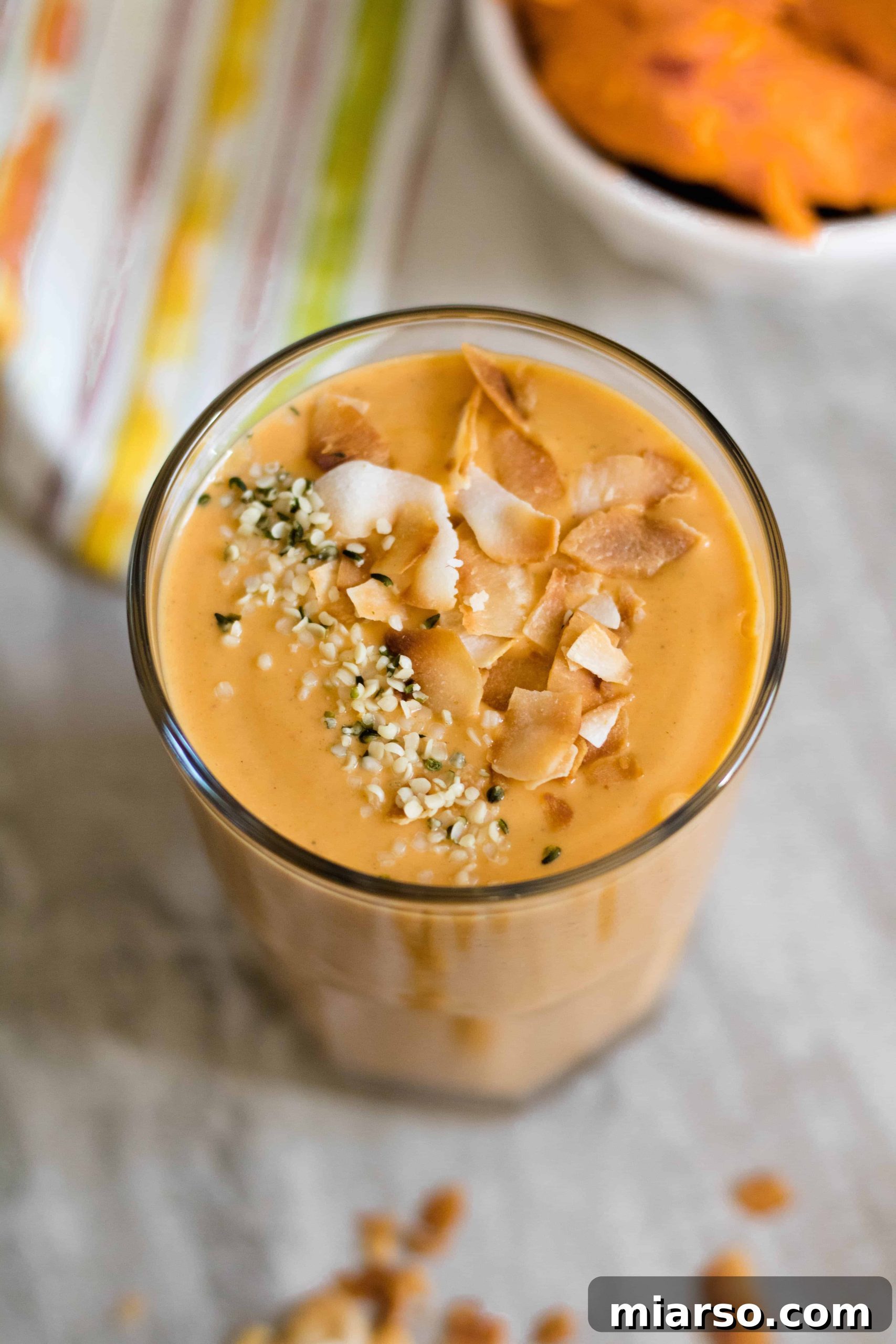 Sweet potato in a smoothie topped with hemp seeds and coconut flakes!