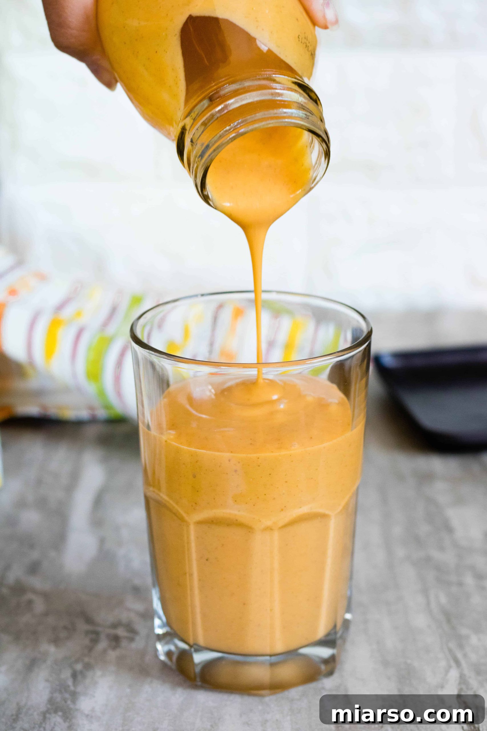 Sweet potato smoothie poured into a glass
