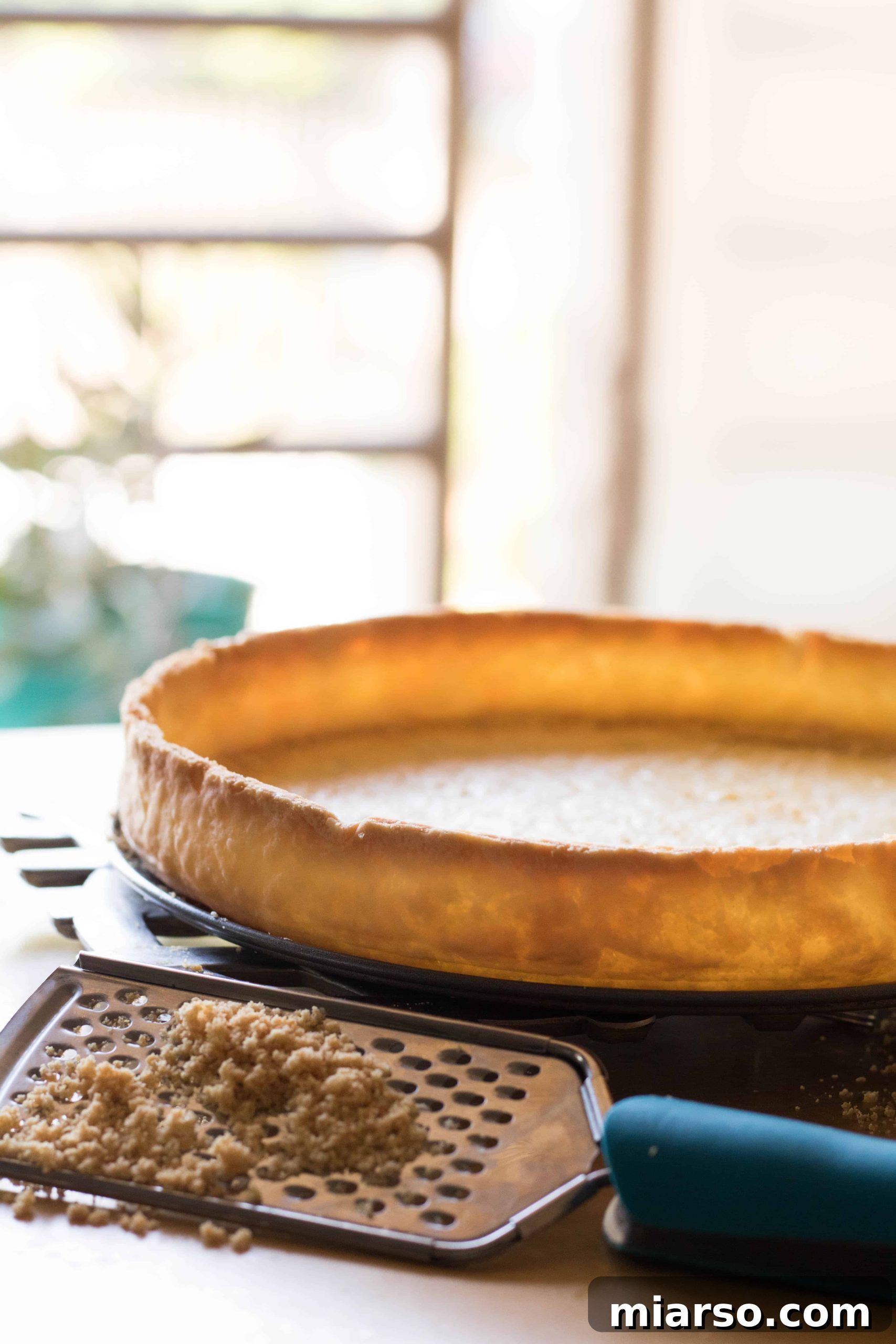 Another perspective of a perfectly trimmed pie crust edge.