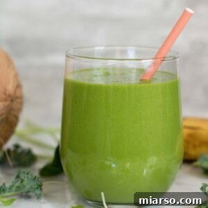 Spinach and Kale Smoothie recipe for breakfast, garnished with fresh greens