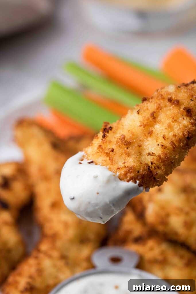 Air fryer chicken tenders dipped in ranch