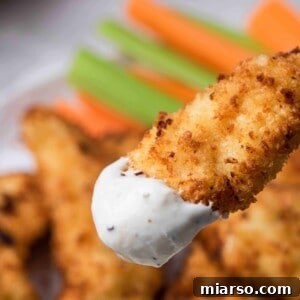 Air fryer chicken tenders dipped in ranch