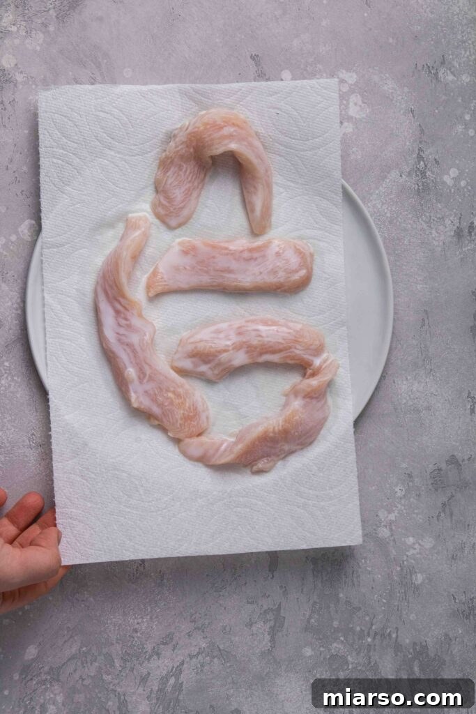 Dry the chicken tenders from the buttermilk