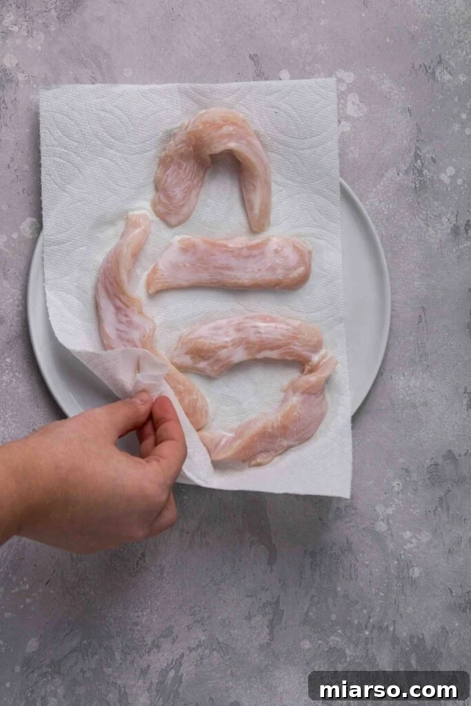Dry the chicken tenders from the buttermilk