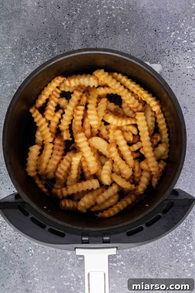 Step by step image showing air fryer basket being shaken