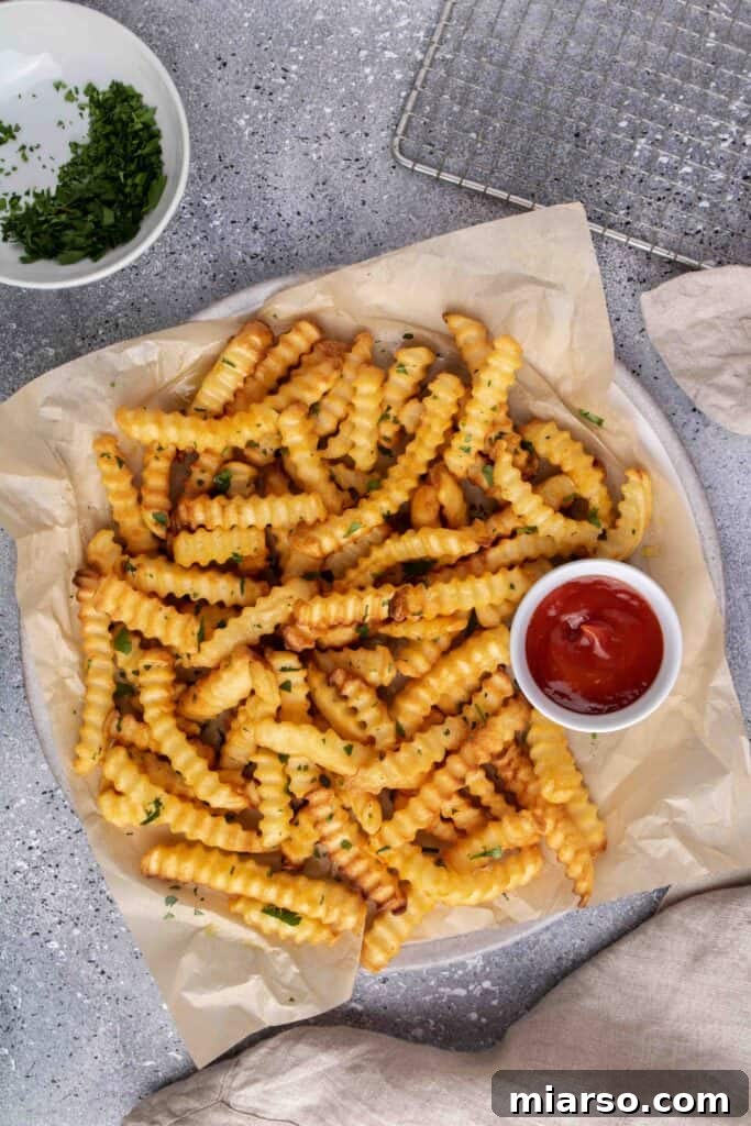 Step by step image showing perfectly cooked frozen french fries in air fryer
