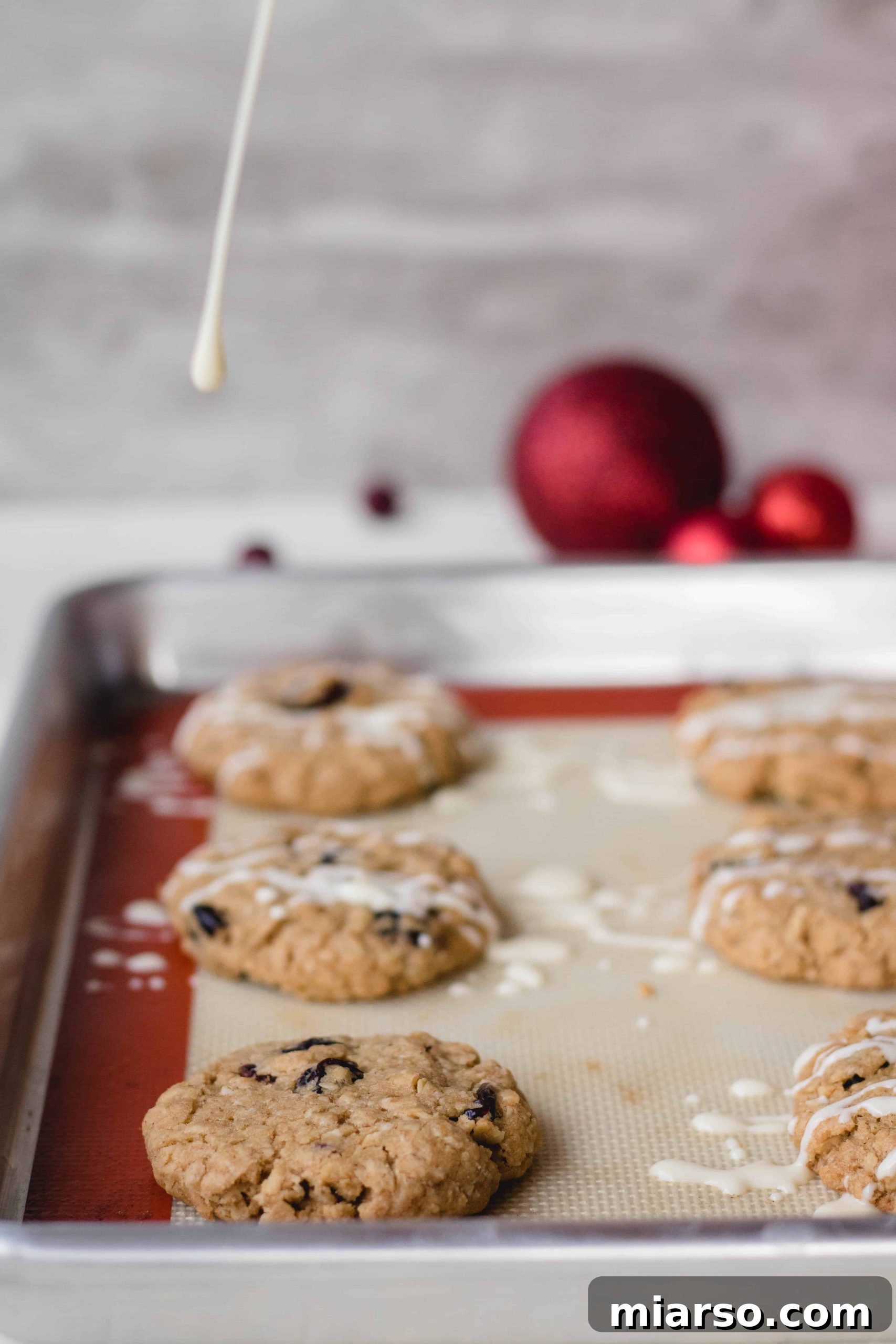 Close-up of cookie dough being scooped onto a baking sheet