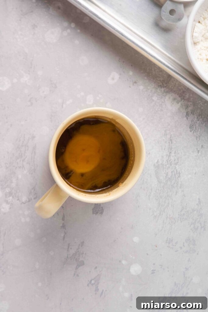 Ultimate Banana Bread Mug Cake Ready in Minutes 7 Add the brown sugar and the egg yolk to the mug