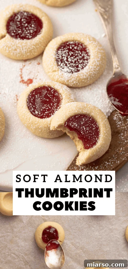 Jam-Kissed Almond Thumbprint Cookies 17 Close-up of freshly baked almond flour thumbprint cookies with vibrant jam fillings