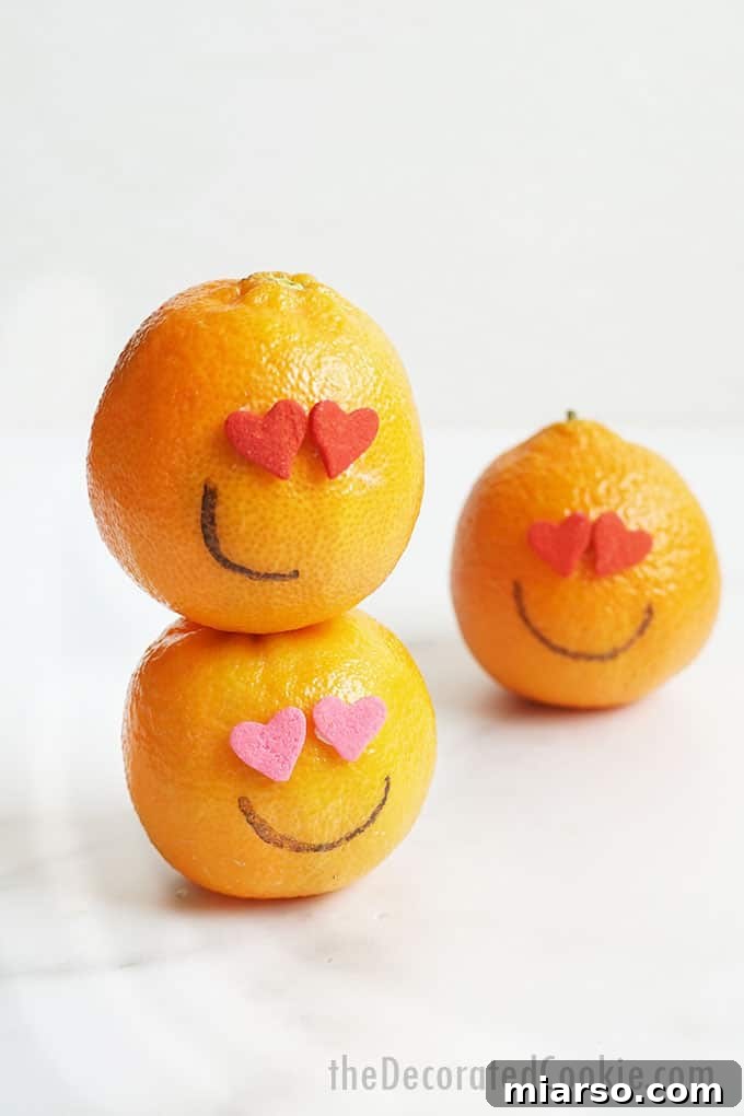 18 Heartfelt No-Bake Valentine Treats Kids Will Adore 13 A colorful arrangement of Valentine's Day decorated fruits, featuring heart shapes and festive garnishes.