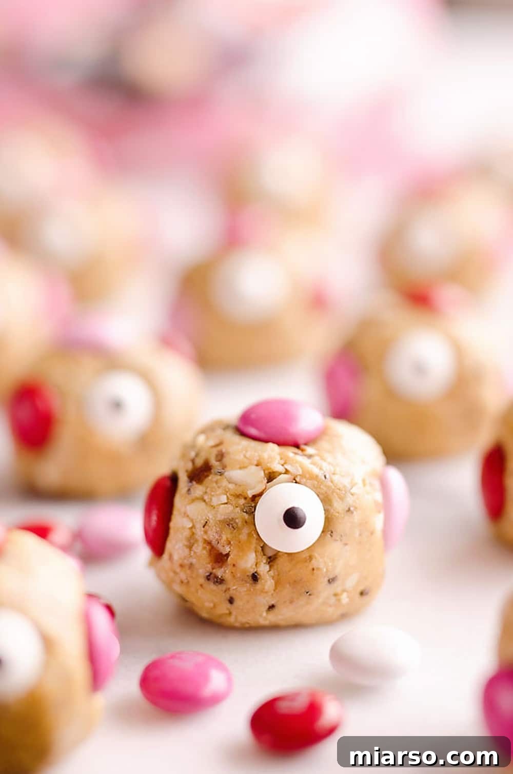 18 Heartfelt No-Bake Valentine Treats Kids Will Adore 18 Cute little love monsters energy bites, featuring googly eyes and colorful decorations.