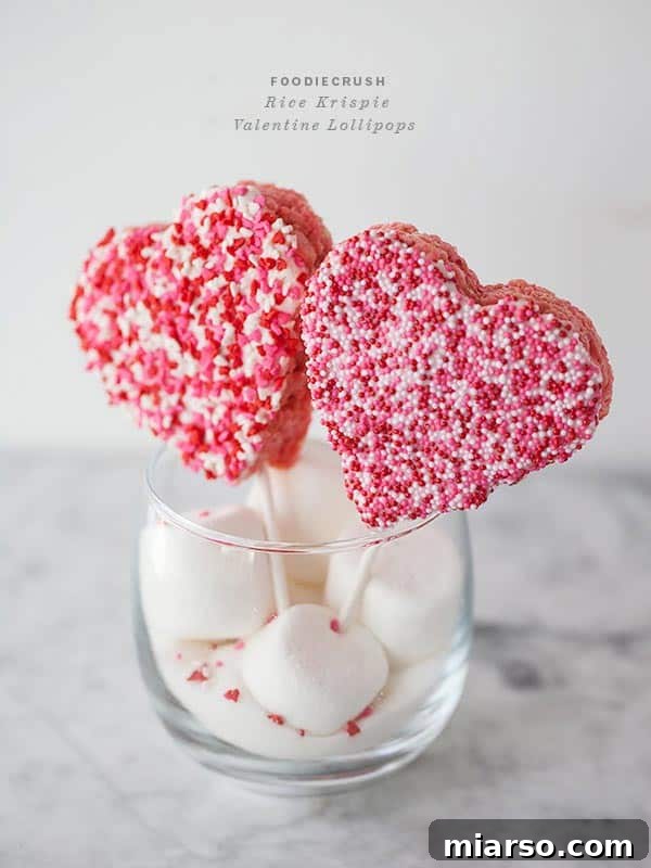 18 Heartfelt No-Bake Valentine Treats Kids Will Adore 20 Rice Krispie Valentine's lollipops, shaped like hearts, dipped in pink candy melts, and decorated with sprinkles.