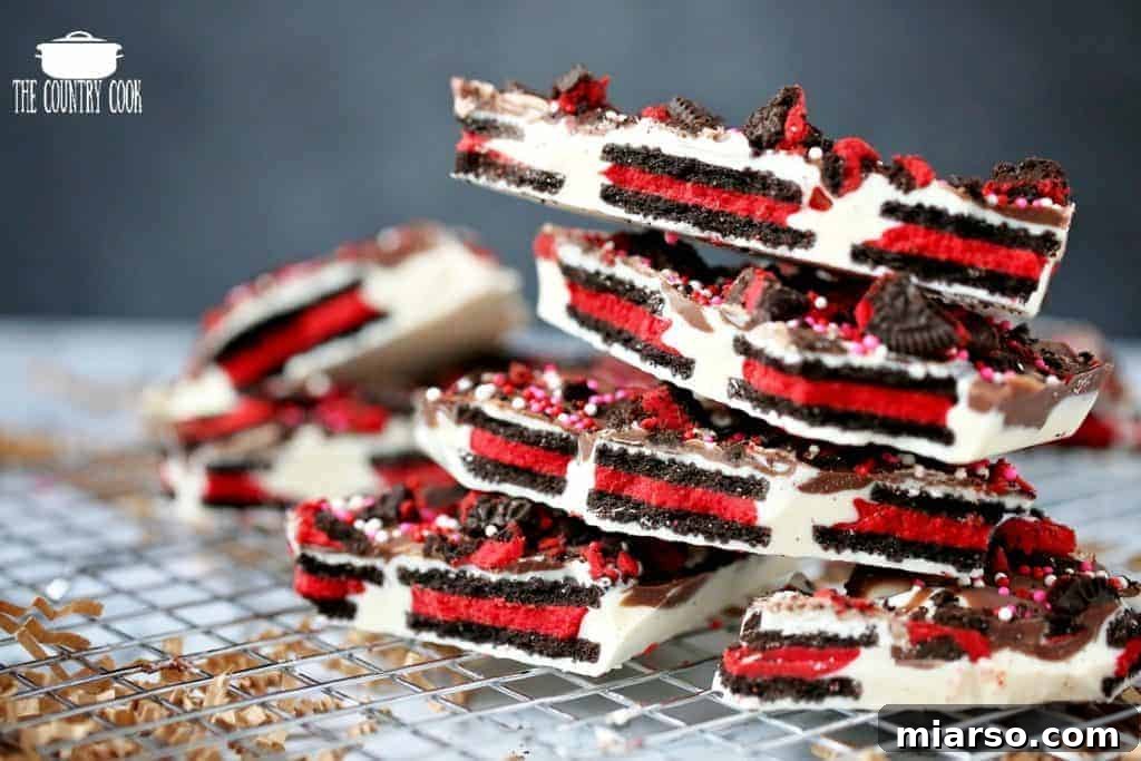 18 Heartfelt No-Bake Valentine Treats Kids Will Adore 8 A tray of Valentine's Day Oreo cookie bark, featuring crushed Oreos, pink chocolate, and festive sprinkles.