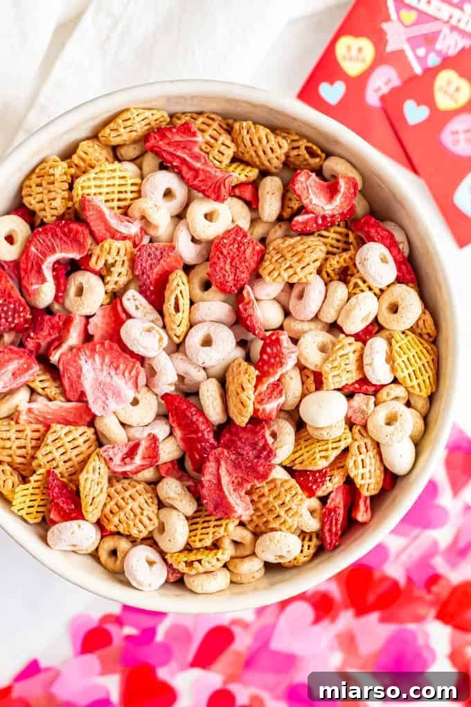 18 Heartfelt No-Bake Valentine Treats Kids Will Adore 10 A festive bowl of toddler-friendly Valentine's Day snack mix, featuring various crunchy and sweet components.