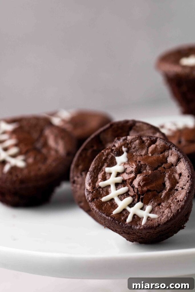 Touchdown Fudgy Brownie Bites 2 Fudgy Football Brownies decorated with white laces, perfect for game day parties