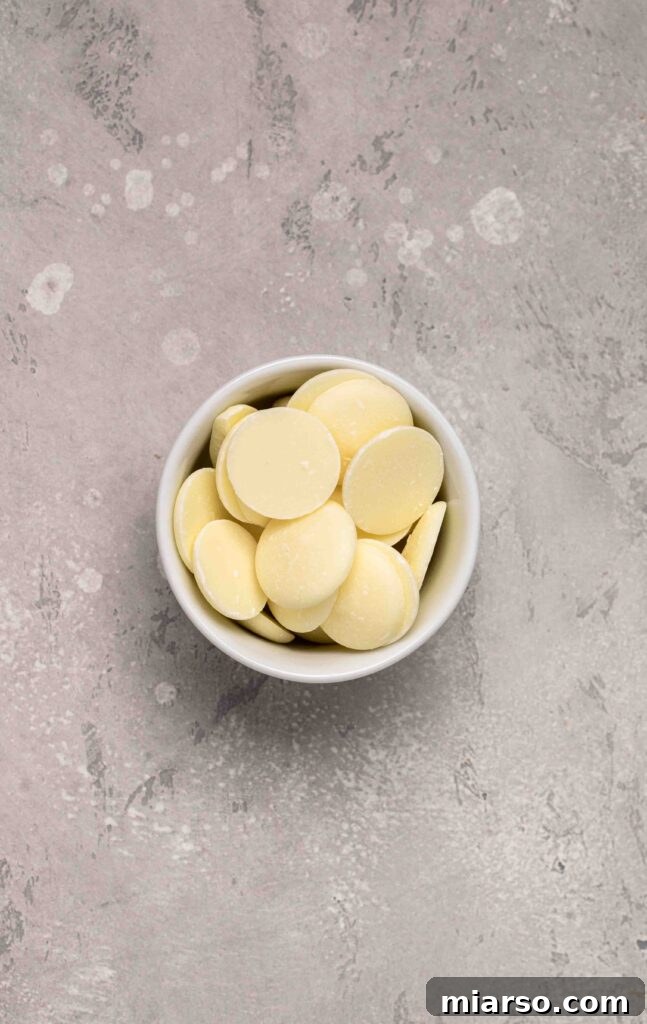 Touchdown Fudgy Brownie Bites 11 Melted white candy melts in a bowl, ready for decoration