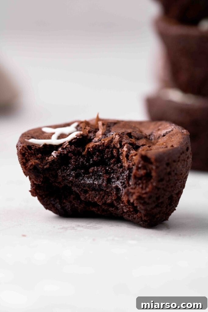 Touchdown Fudgy Brownie Bites 14 Close up of a perfectly fudgy brownie bite with a delicate crackly top