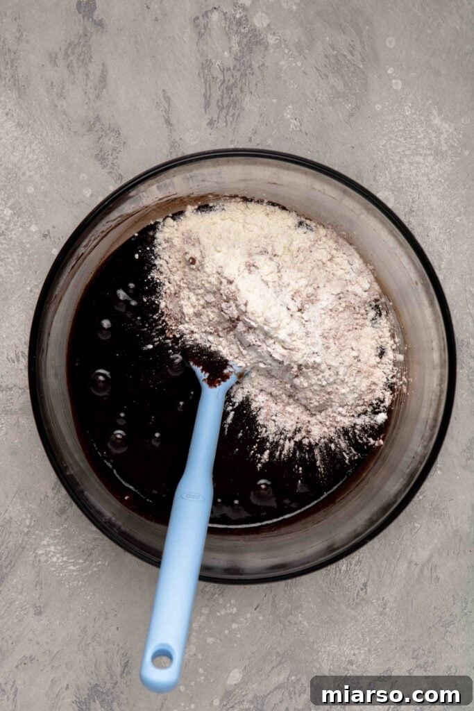 Touchdown Fudgy Brownie Bites 7 Carefully add the dry ingredients to the brownie batter, folding gently