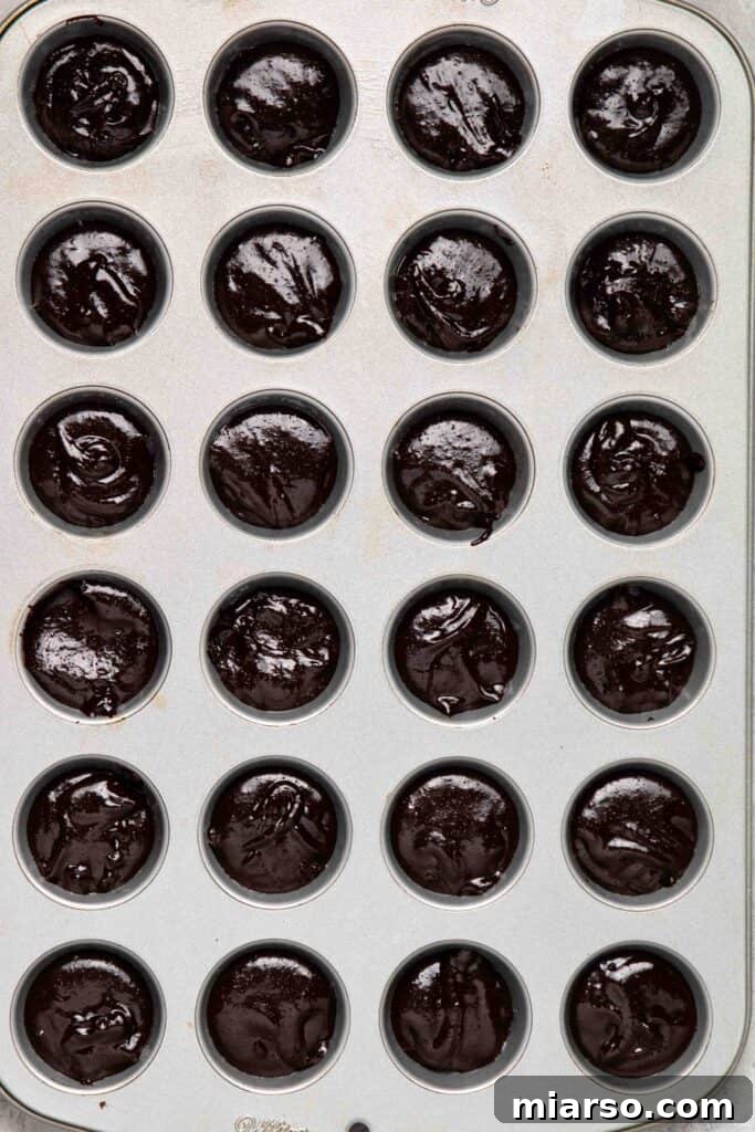 Touchdown Fudgy Brownie Bites 9 Brownie batter neatly scooped into a mini muffin tin