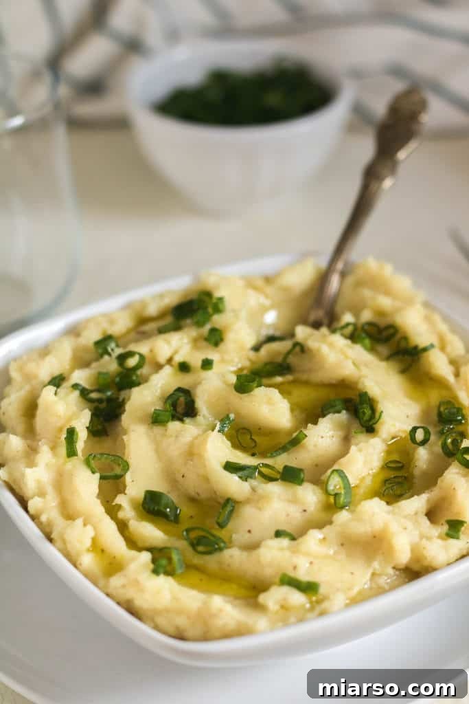 Creamy Brown Butter Garlic Mashed Sweet Potatoes, served as a holiday side dish.
