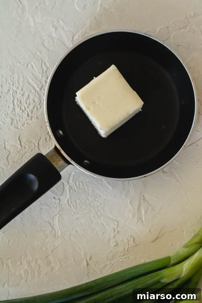 Melted butter in a saucepan, beginning to foam.