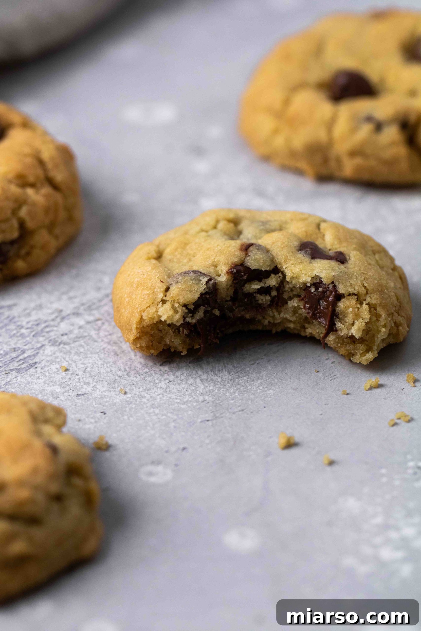 Air fryer chocolate chip cookie with a bite taken out of it