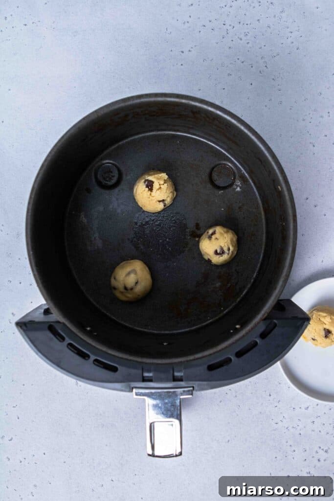Raw cookie dough in the air fryer basket