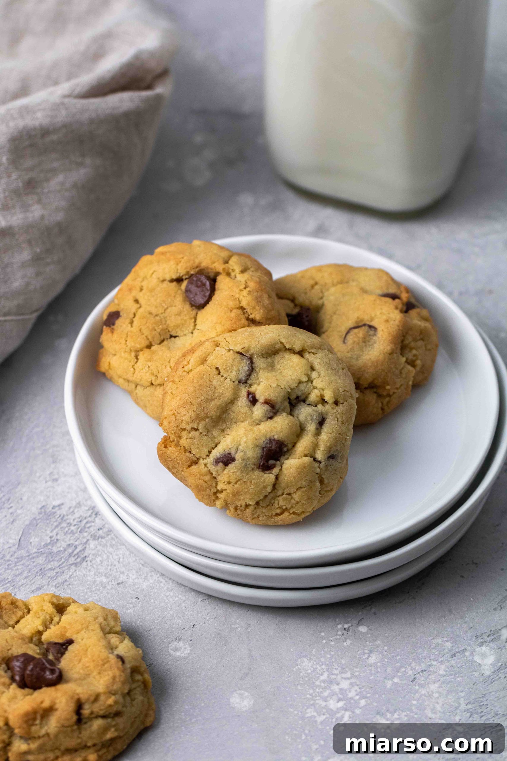 Air fried chocolate chip cookies on a plate.