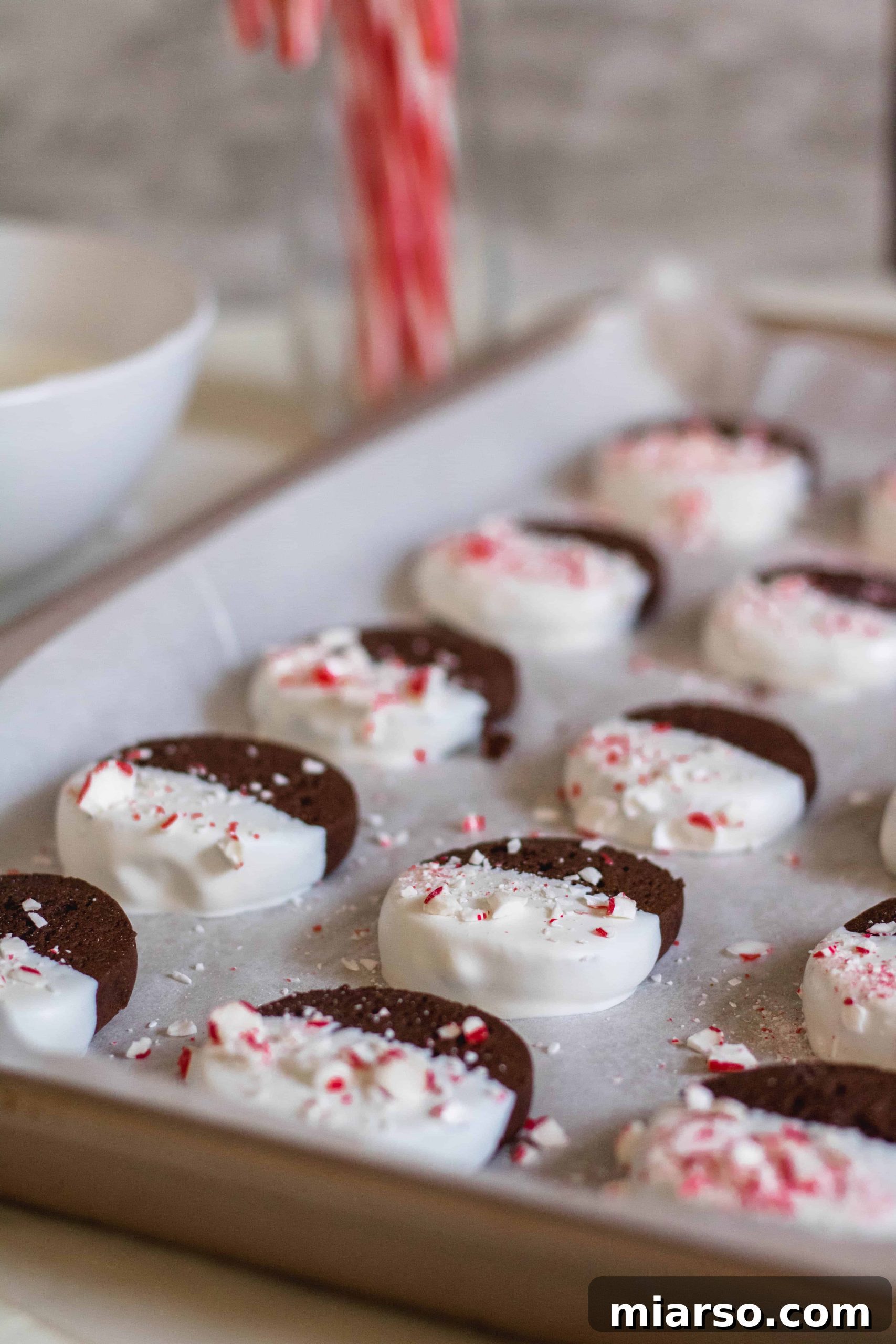 Gourmet Chocolate Peppermint Crunch Logs 5 Crushed candy cane pieces scattered on a surface, ready for cookie topping