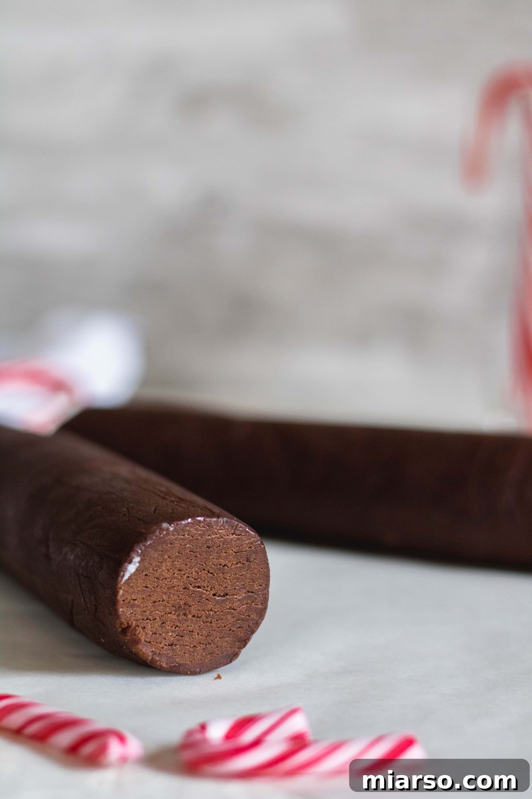 Gourmet Chocolate Peppermint Crunch Logs 6 Two cookie dough logs wrapped in plastic, ready for chilling