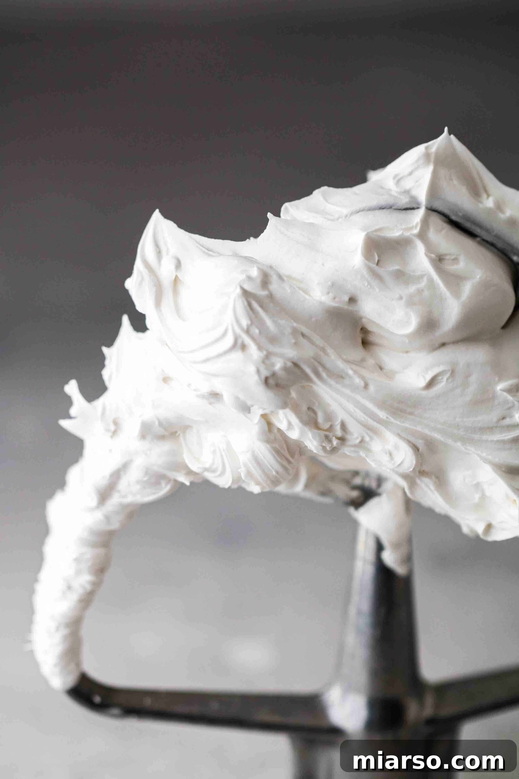 Velvety Small Batch Swiss Meringue Buttercream 2 Close up of Swiss meringue buttercream on paddle attachement