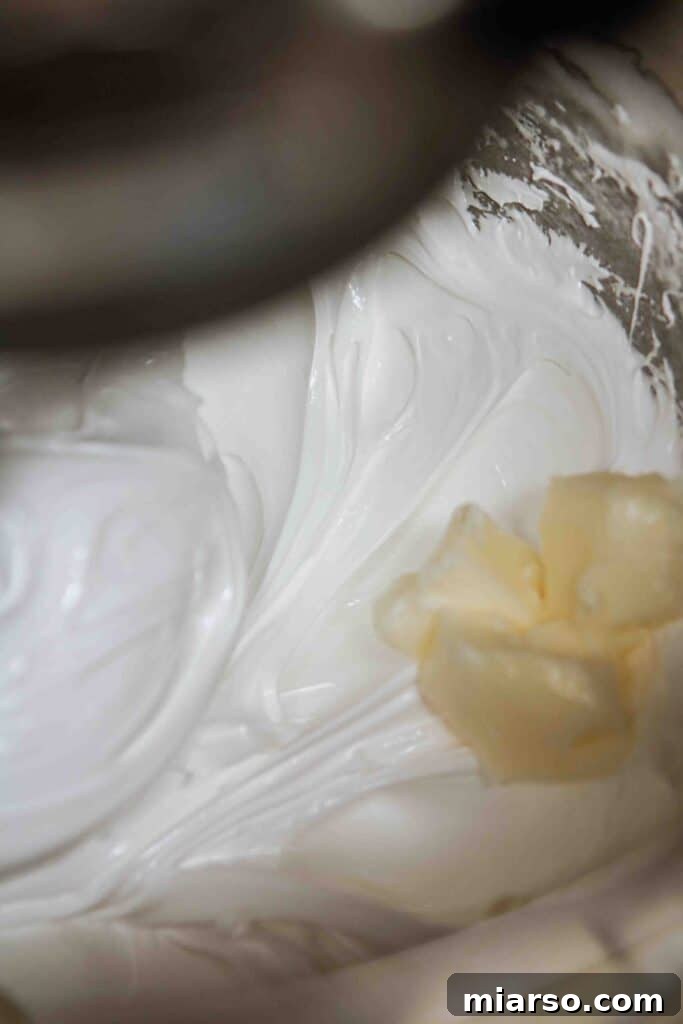Velvety Small Batch Swiss Meringue Buttercream 8 Add the butter to the stiff peak meringue