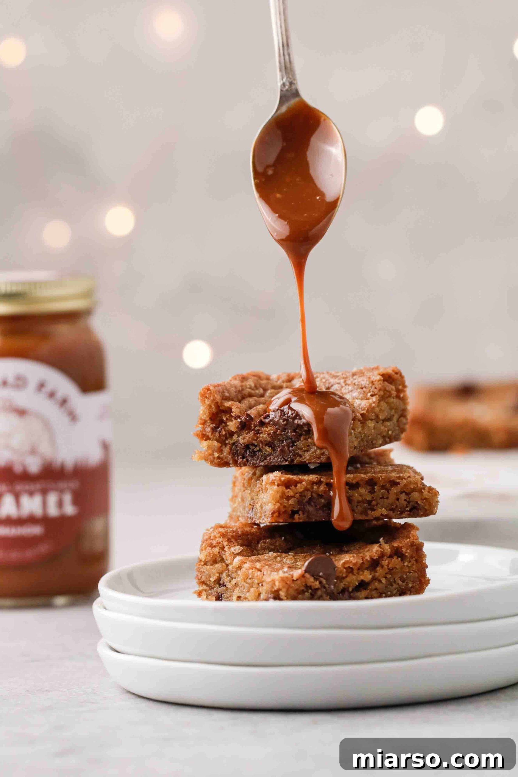 Sweet Tomatoes' Homestyle Chocolate Chip Bars 9 A perfectly arranged stack of delicious chocolate chip cookie bars, highlighting their rich texture and generous chocolate