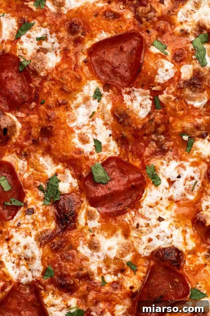 Close-up of a perfectly textured pizza dough, ready to be shaped and topped.