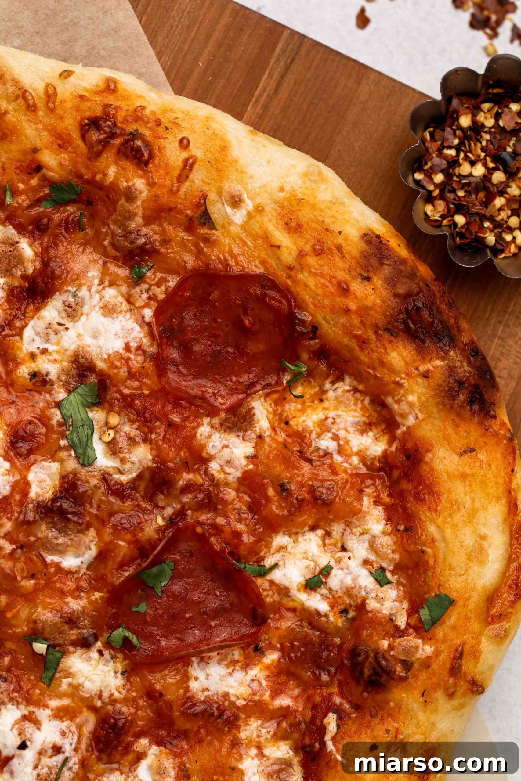 Crispy homemade pizza dough, showcasing the perfect golden-brown crust texture.