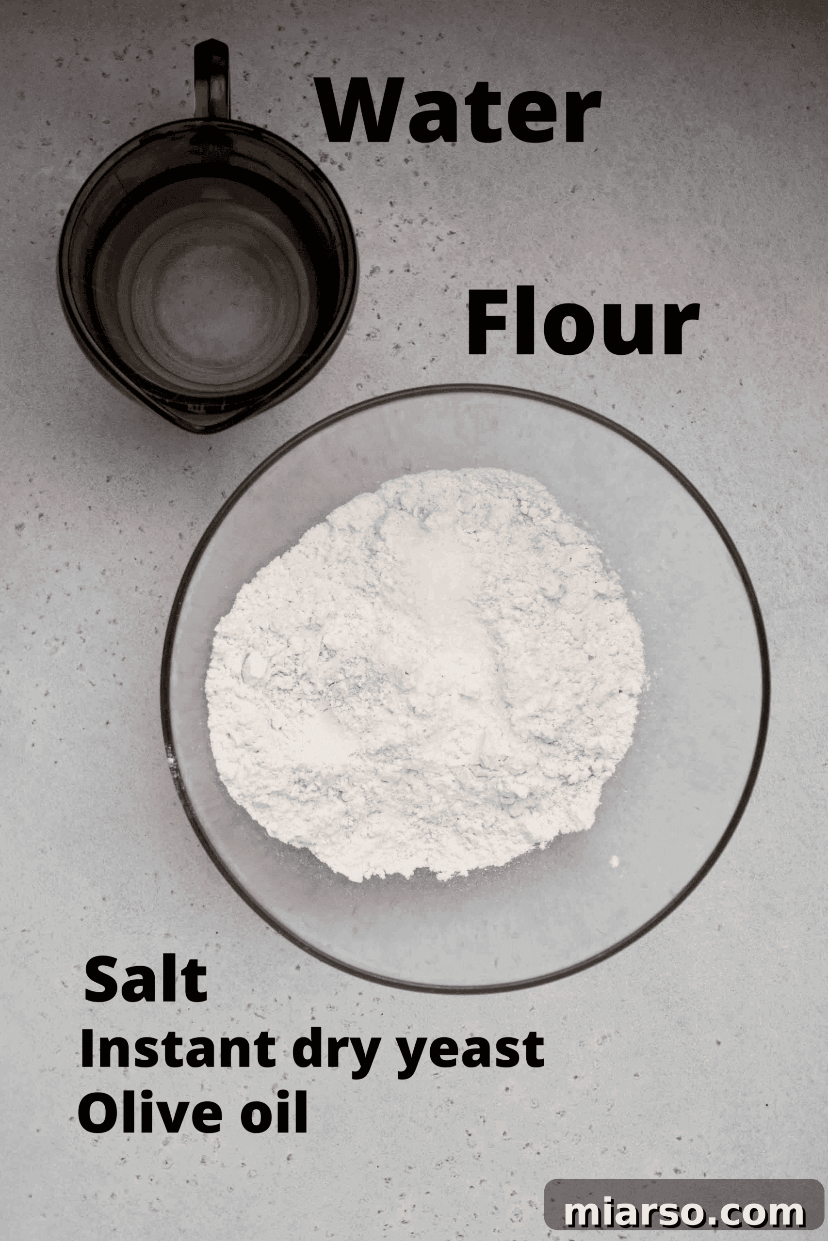 Preparing the no knead pizza dough in a bowl, showing its sticky texture before rising.