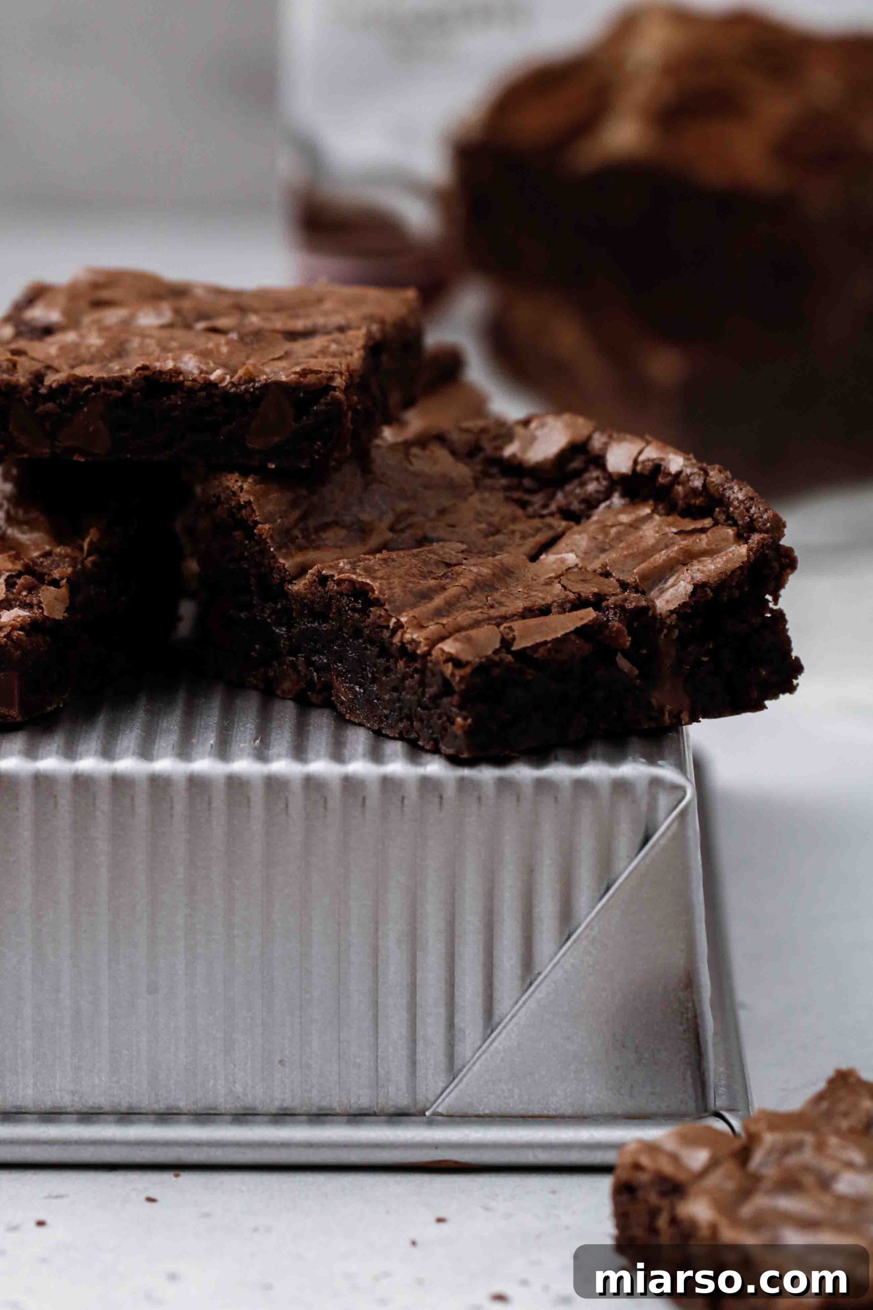 Close up of a boxed brownie with chocolate chips and a crinkled top