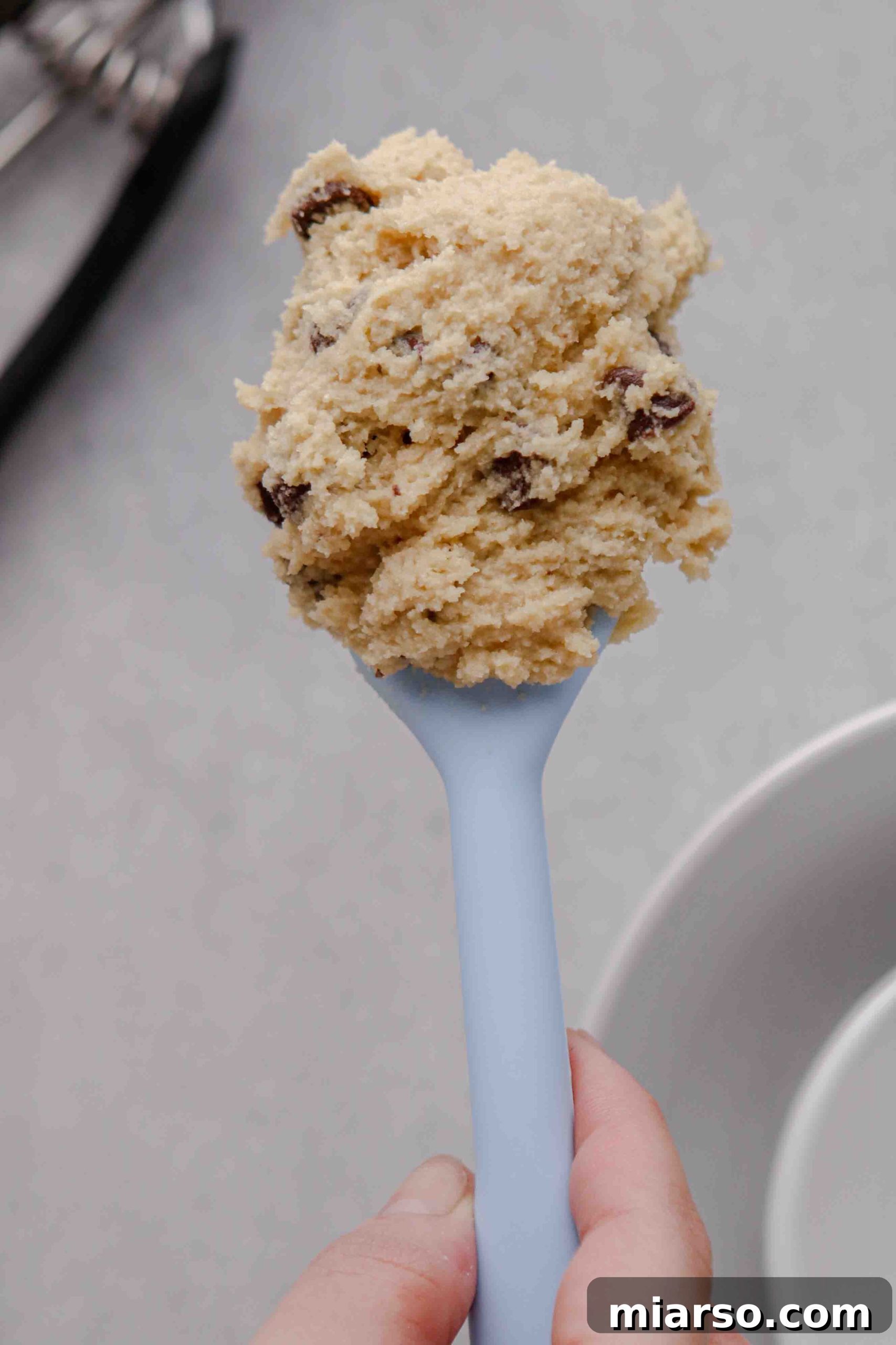 Almond flour cookie dough resting on a spatula.