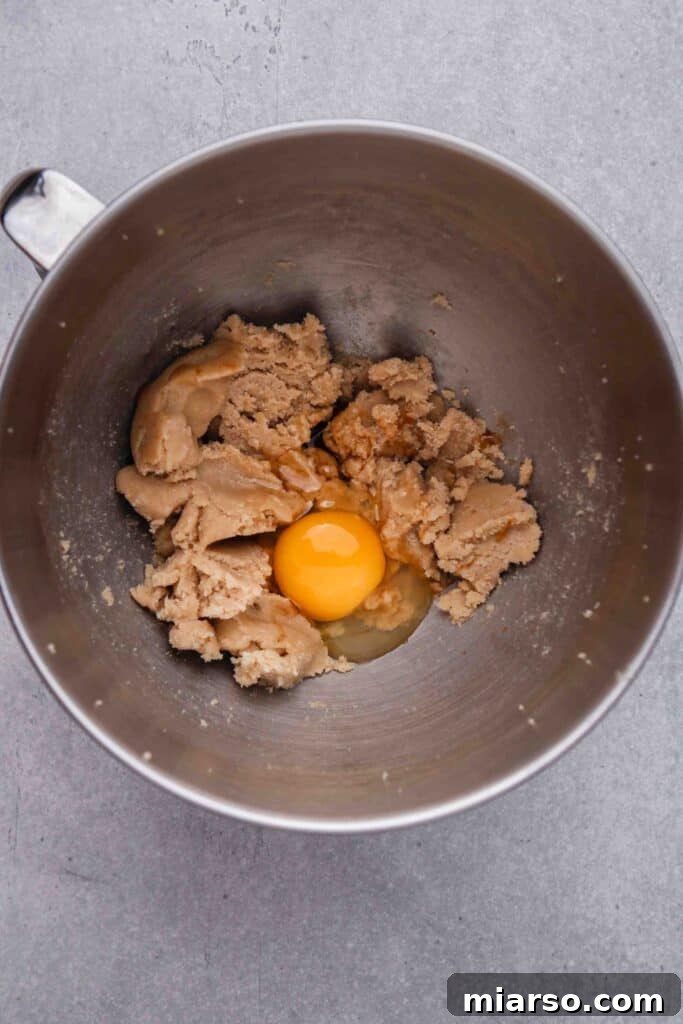 Add the egg to the creamed butter and sugar mixture