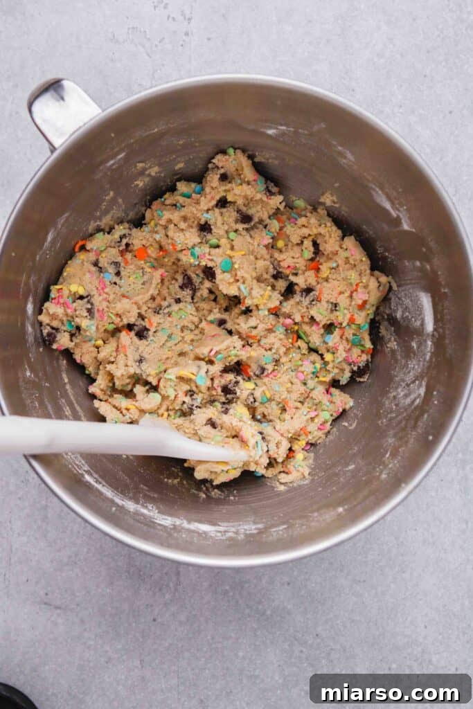 Close-up of cookie dough mixed with festive sprinkles