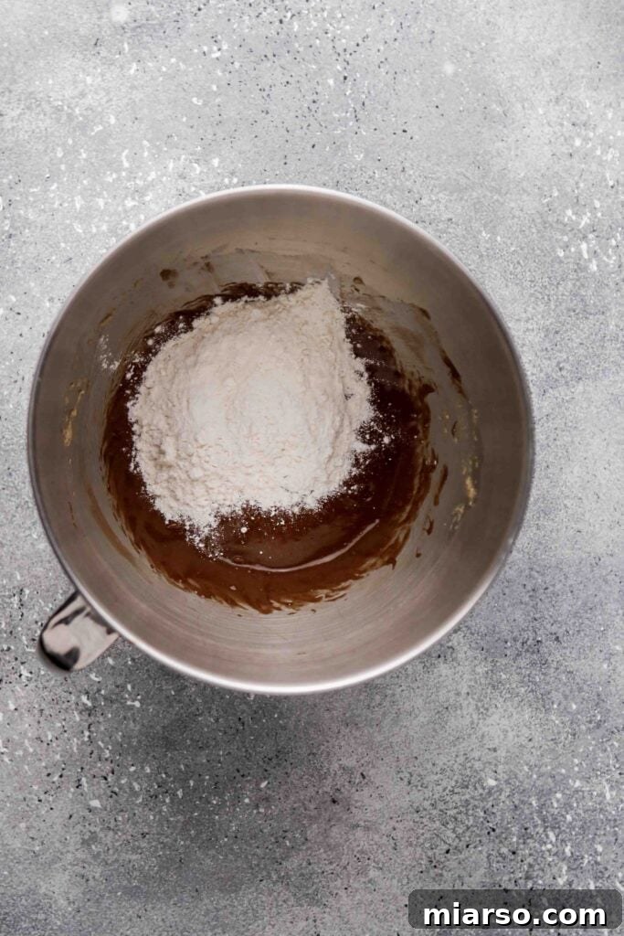 Fold in the flour Gently into the brownie batter