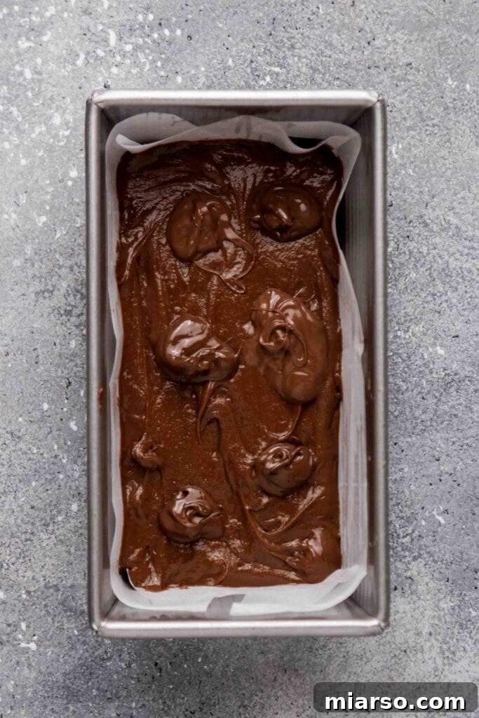 Add dollops of Nutella on top of the brownie batter