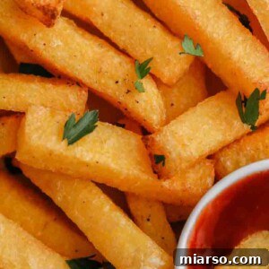 Close up of golden crispy air fryer polenta fries