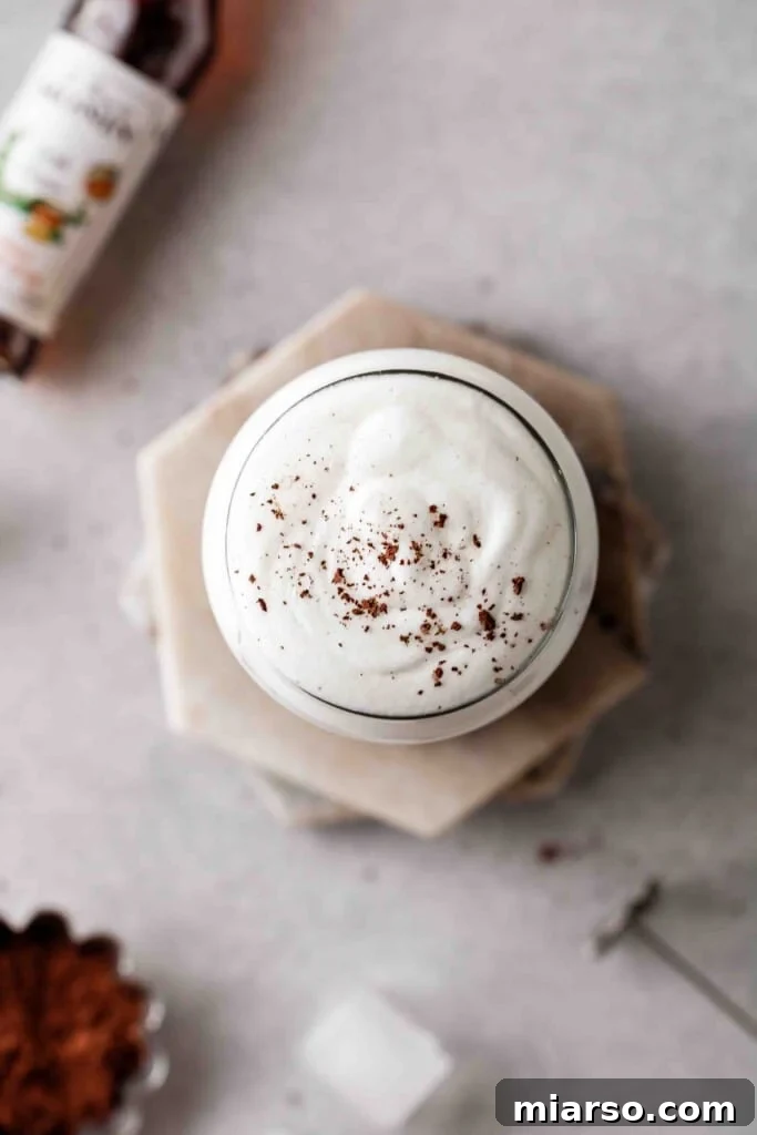 Overhead shot of vanilla sweet cream with cocoa powder