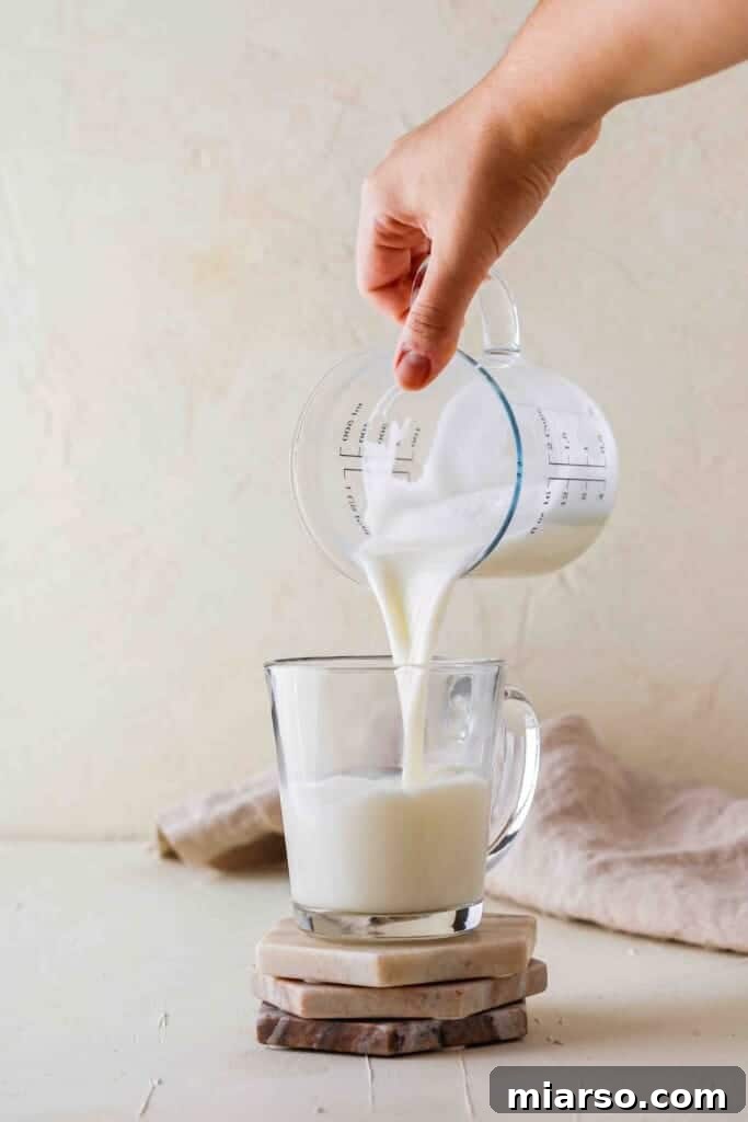 Steamed milk for Starbucks latte in a mug
