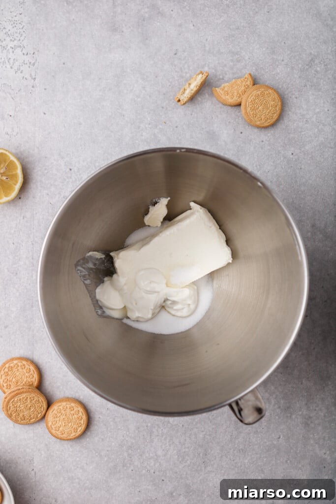Creaming the cream cheese with sugar in a stand mixer