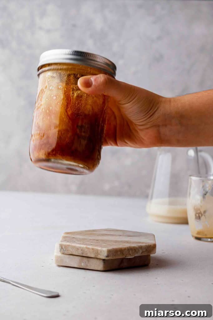 Golden Oat Shaken Espresso 9 Shaking espresso and syrup in a sealed mason jar