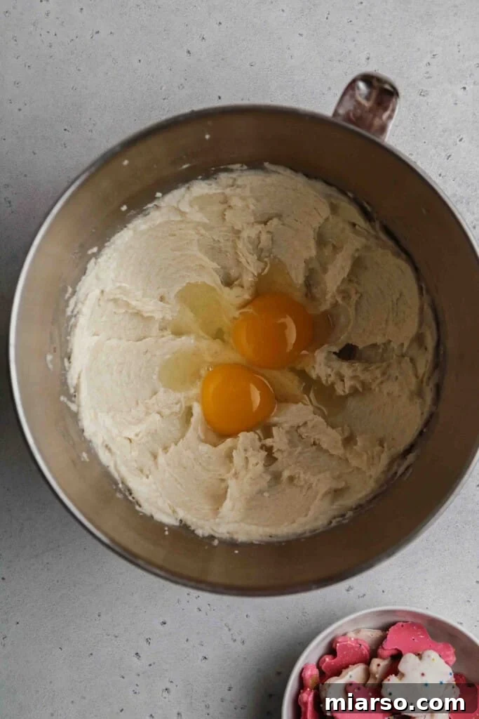 Add the egg and the extracts to the butter mixture